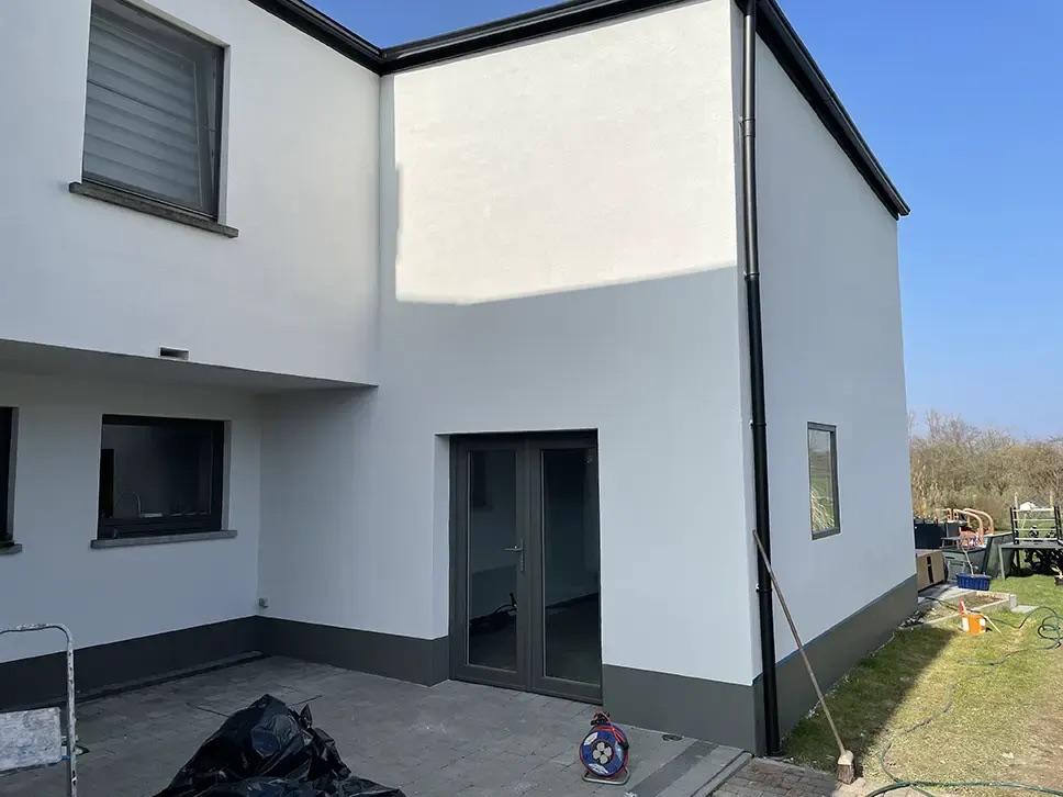 Façade isolée par l'extérieur avec panneaux et enduit à Molenbeek-Saint-Jean, Bati Belgium Group